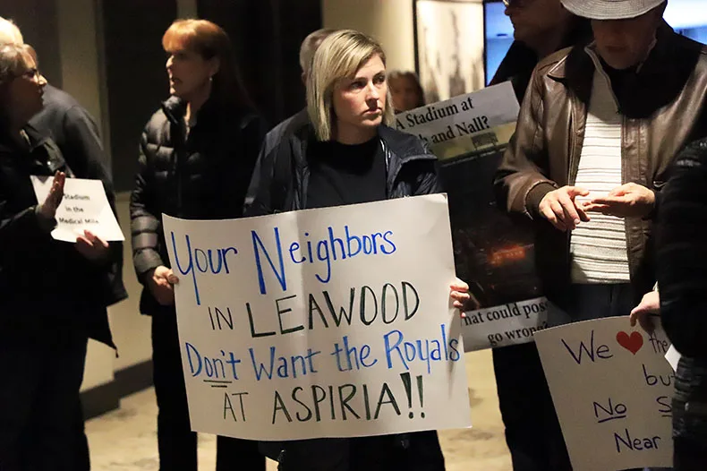 Around two dozen Overland Park and Leawood residents crowded into the lobby of Overland Park City Hall Monday evening to push back on potential plans to put a new Royals stadium at the Aspiria campus.