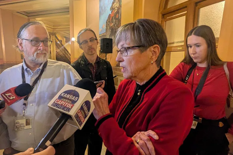Gov. Laura Kelly talks to reporters in December. Kelly has applauded the move to bring the Chiefs to Kansas.