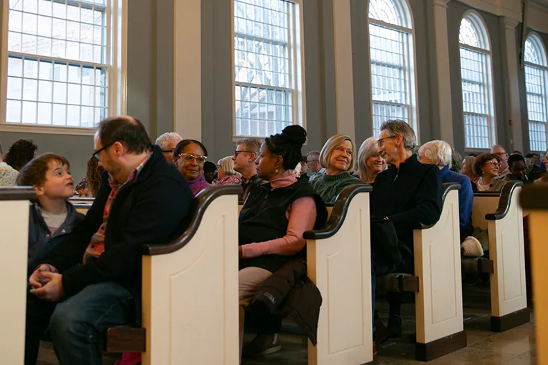 Toward the end of the event, the crowd participated in a series of exercises — prompted by Dr. Williams — including 10 seconds of eye contact. Photo credit Juliana Garcia. 