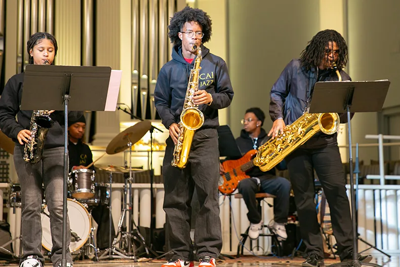 Members of the Comprehensive Art Institute youth band perform versions of "Little Sunflower" by Freddie Hubbard and "Impressions" by John Coltrane. Photo credit Juliana Garcia. 