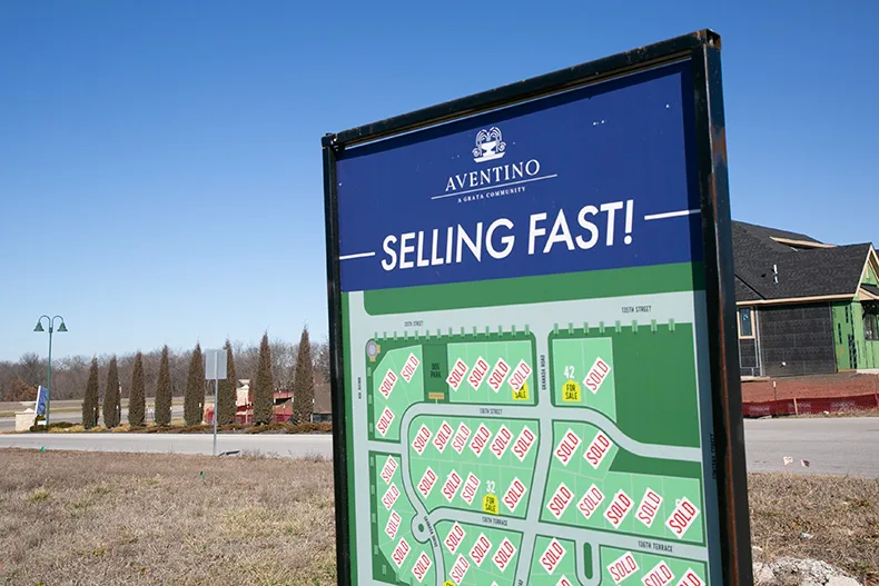 A sign at the Aventino single-family home development off of 135th Street in Leawood. Photo credit Juliana Garcia.