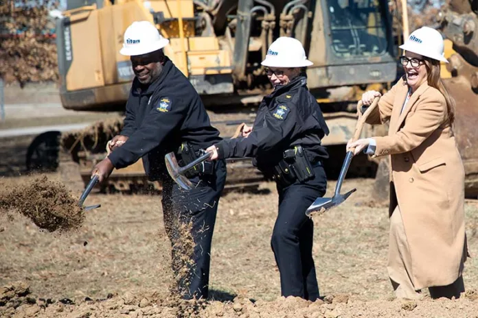 Overland Park city leaders as well as police officials past and present celebrate the start of construction on a new police training center.