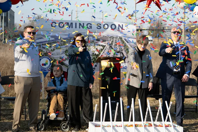 A group of people with confetti in the air.