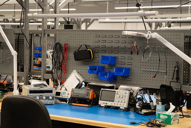 A desk with electronics tools. 