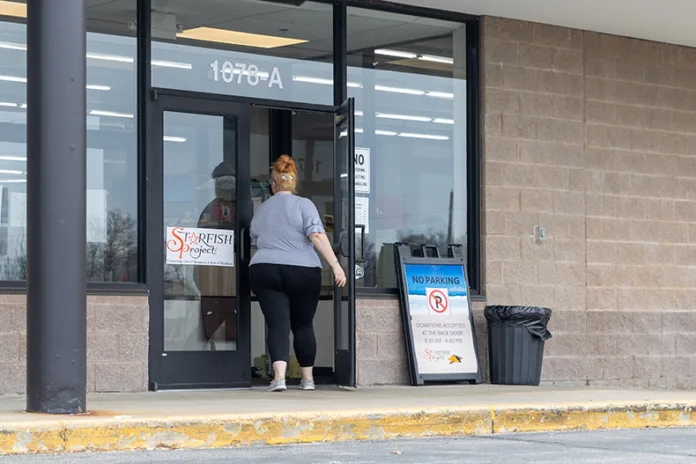 A customer walks into the Starfish Project located in a strip mall off of Santa Fe Street in Olathe.