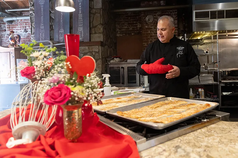 Chef Sergio prepares for a Valentine’s Day dinner at the Culinary Center of Kansas City on Thursday, Feb.12, in Overland Park.