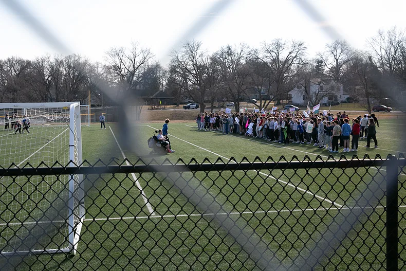 Indian Hills Middle School students at a Feb. 12 walkout. Students stayed on the football field chanting "Melt ICE" for roughly 45 minutes.