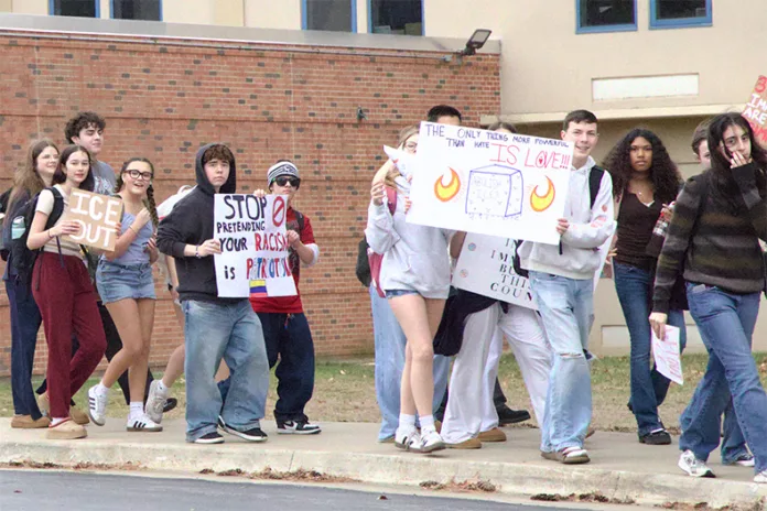 Shawnee Mission East students walk out of school on Tuesday, Feb. 17, to protest Immigration and Customs Enforcement under the Trump administration. Photo credit Lucie Krisman.