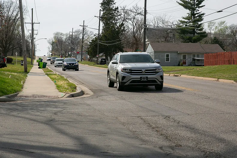 Cars drive along the Roeland Park side of 47th Street, also known as County Line Road, nearing the Reinhardt Drive intersection. Photo credit Juliana Garcia.