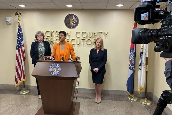 Jackson County Prosecutor Melesa Johnson talks to reporters on Tuesday, defending her office's charging of one of the men accused in the fatal Super Bowl parade shootings in February 2024. Chief Trial Assistant Kristiane Bryant (left) and Assistant Prosecuting Attorney Hallie Schuman (right) handled the case.