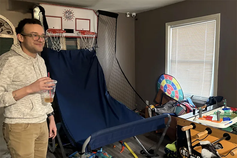The Stahls' foster home is filled with toys and arcade games, like basketball pop-a-shot. Jonathan says the room is meant to remind their foster children that they are still kids.