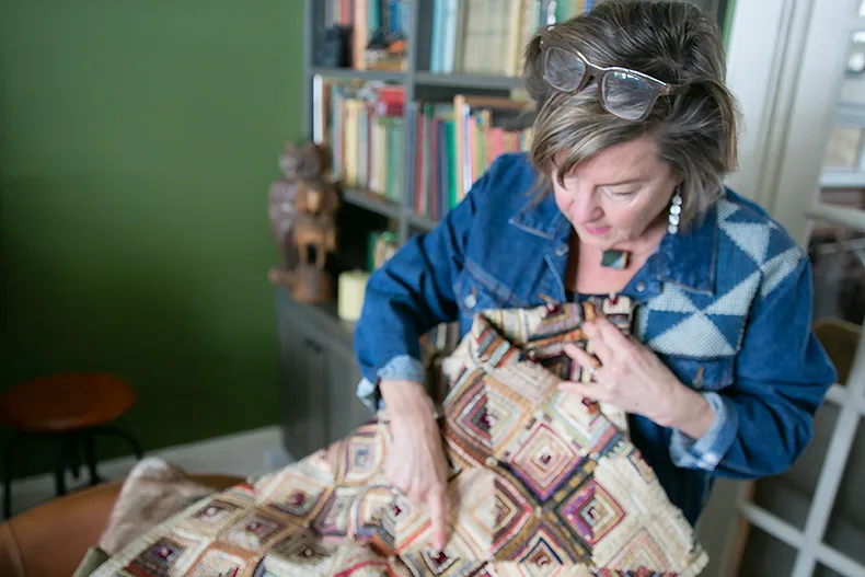 Amy Barickman points to a quilt that is featured in her new book. 