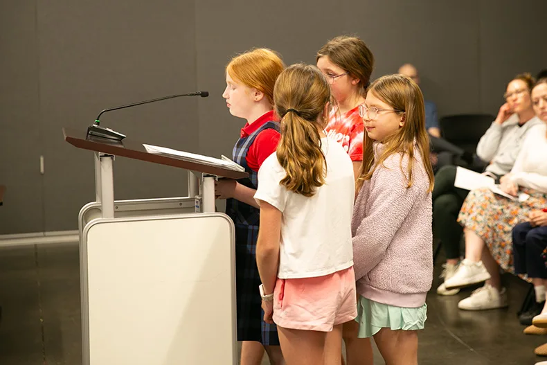 Annie Newell and a group of her friends at the March 9 city council meeting. Photo credit Juliana Garcia. 
