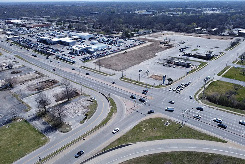 An aerial view of several recently demolished properties on the southeast corner of I-35 and Santa Fe Drive in Olathe. Photo credit Mike Frizzell.