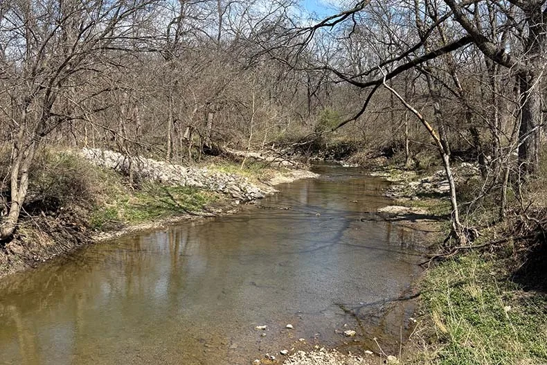 Wolf Creek through the Overland Park Arboretum. The Blue River begins at the confluence of Coffee and Wolf creeks.