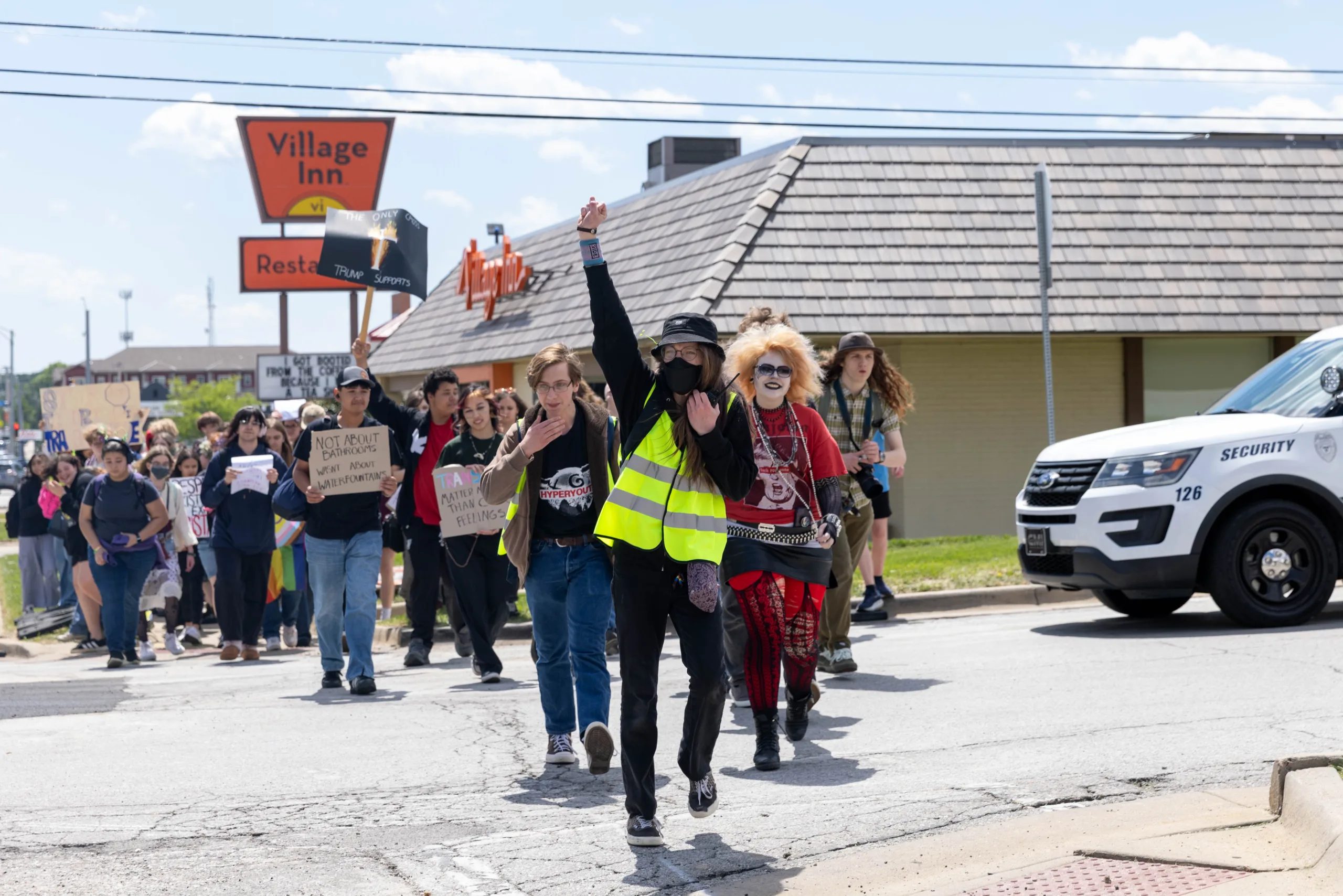 Jade S. leads Shawnee Mission North High School students on their walkout north down Broadmoor Street to Broadmoor Park on Friday, May 1st. Photo credit Kylie Graham.