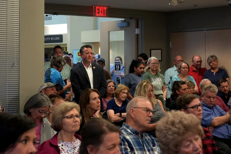 Sen. Doug Shane (standing, back left), who represents Kansas Senate District 37, stands among the residents opposed to the Beale Infrastructure data center at Monday night’s Gardner City Council meeting.