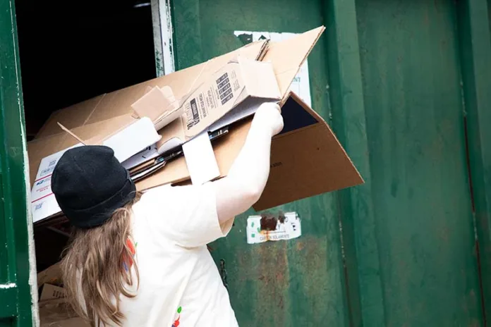 Robert Maher drops off cardboard on Thursday afternoon.