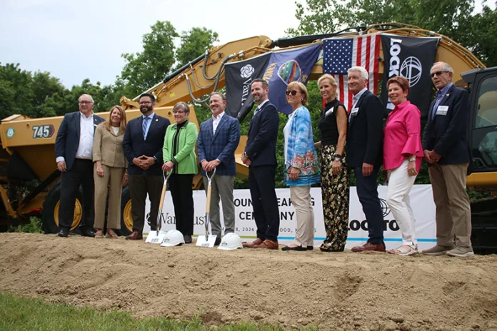 From left, Leawood Mayor Marc Elkins, Barbara Hake, County Chairman Mike Kelly, Gov. Laura Kelly, Ron Lockton, Joshua Jefferson, Leawood Councilmembers Lisa Harrison, Mary Larson, Steve Kaster, Julie Cain and Alan Sunkel, pose for a photo at the groundbreaking ceremony for the new Lockton headquarters in Leawood.