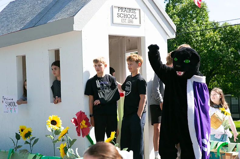 Prairie Panthers paraded down Mission Road with a small school house. Photo credit Juliana Garcia. 