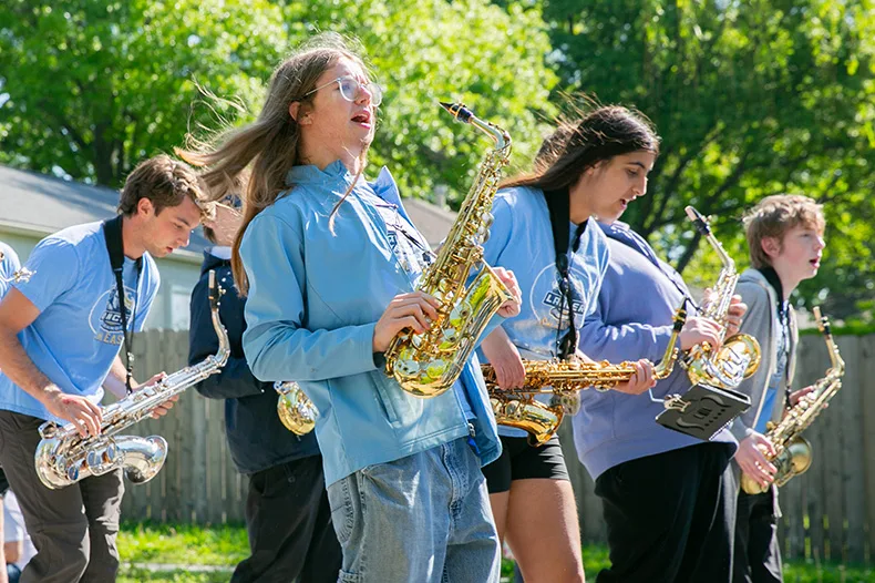 Shawnee Mission East’s band marched south down Mission Road from 79th to 83rd streets, leading the parade. Photo credit Juliana Garcia.