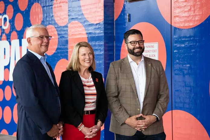 From left, Mayor Curt Skoog, KC 2026 CEO Pam Kramer and Johnson County Chair Mike Kelly at the Overland Park Convention Center.
