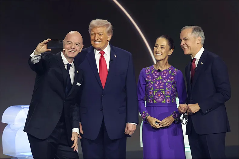 Infantino poses with President Trump, Mexico President Claudia Sheinbaum, and Canada Prime Minister Mark Carney at the World Cup draw ceremony held in Washington, D.C., on Dec. 5, 2025.