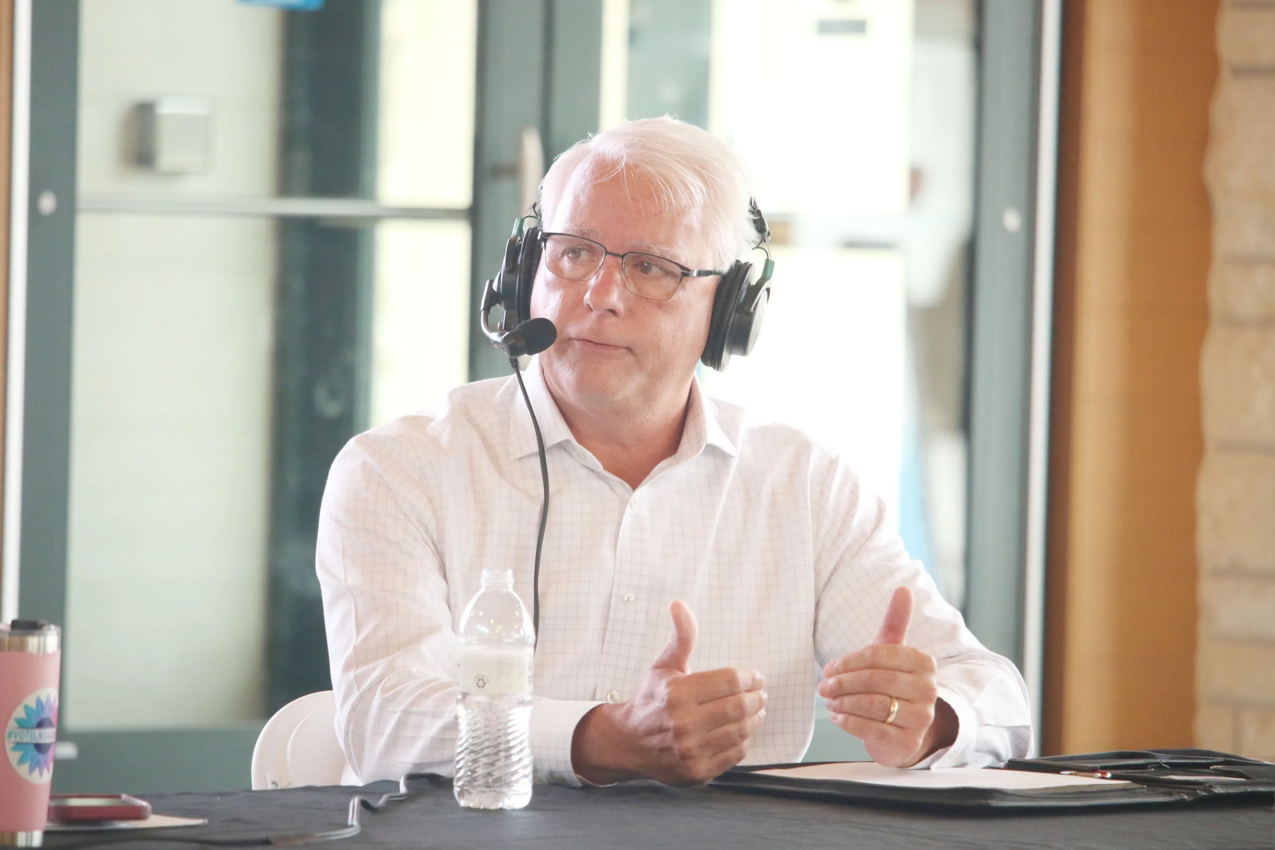 Curt Skoog, a candidate in the Democratic gubernatorial primary, participates in a forum on KCUR's "Up to Date" at the Overland Park Farmers' Market building June 11.