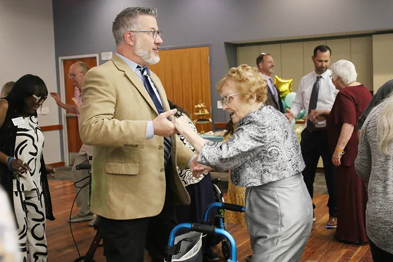 From left, Frank Trimboli, executive director of Morningside Place dances with Morningside Place resident Pat Pope during the senior prom at Matt Ross Community Center on June 17.