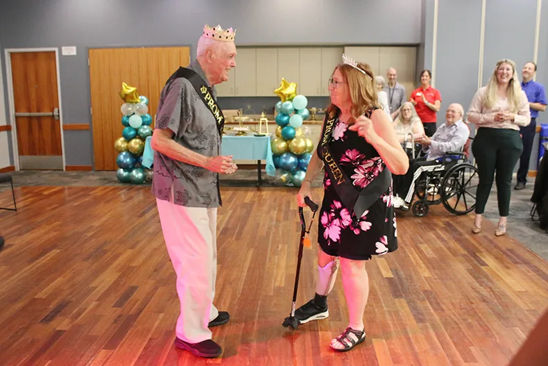 From left, David Miller and Lois Dick, prom king and queen of Sunrise of Leawood, dance after receiving their crowns and sashes.