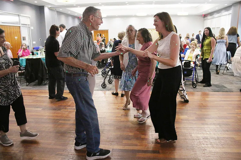 From left, Morningside Place resident Tom Nicely dances with Jennie Jennings, a speech therapist from Morningside Place.