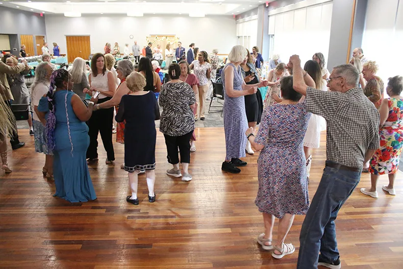 Attendees hit the dance floor during the senior prom at Matt Ross Community Center on June 17.