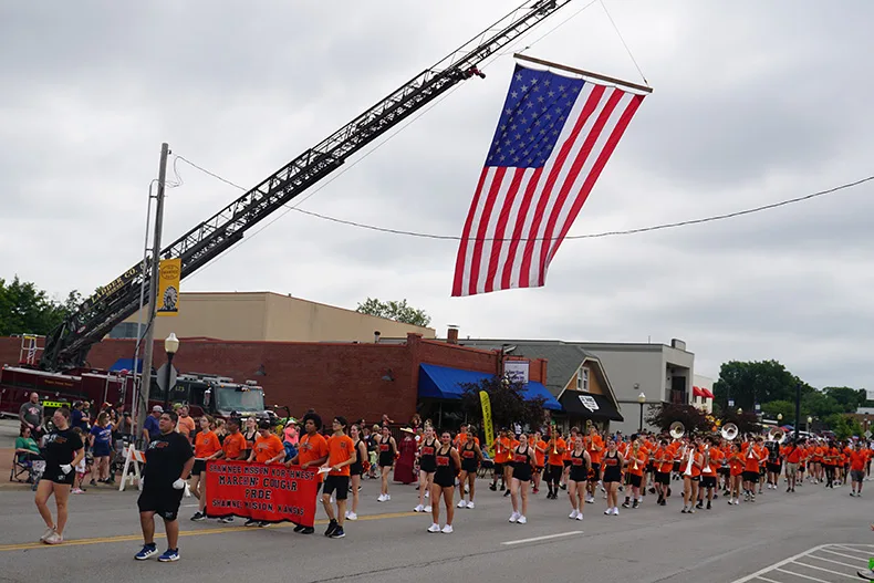 The American Flag waves at Old Shawnee Days Parade. Photo credit Andrew Gaug.