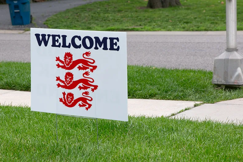 A yard sign off 69th Street and Roe Avenue welcomes the England national soccer team to Prairie Village. Photo credit Juliana Garcia.