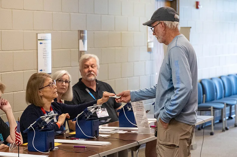 Early voters check in for the Aug. 4 primary on Thursday, July 30, at Hilltop Conference Center in Overland Park.
