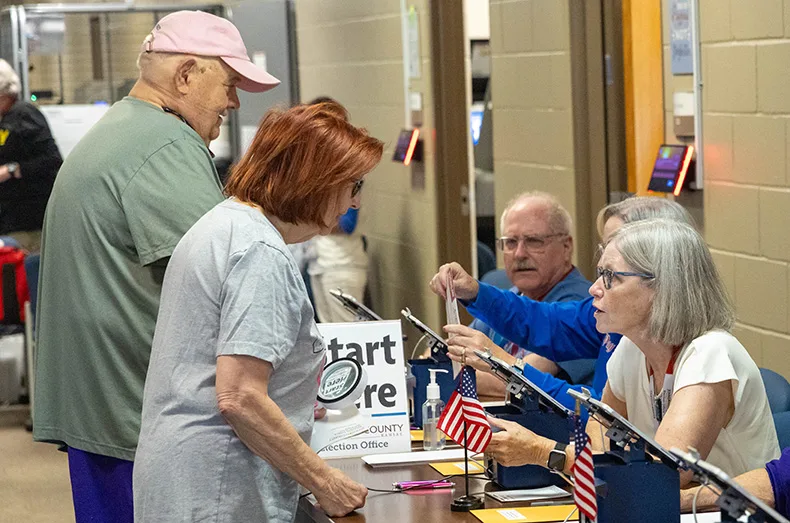 Early voters check in for the Aug. 4 primary on Thursday, July 30, at Hilltop Conference Center in Overland Park.