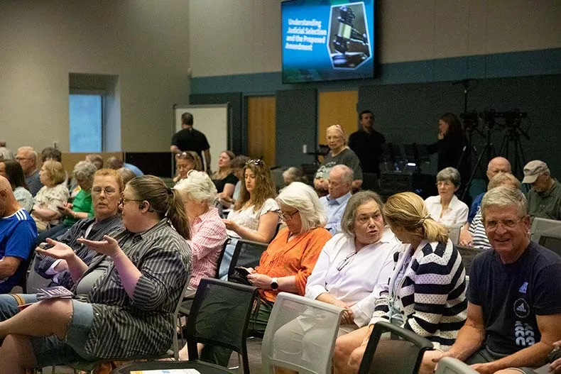 Members of the public packed a meeting room at the Central Resource Library for a discussion of a judicial constitutional amendment.