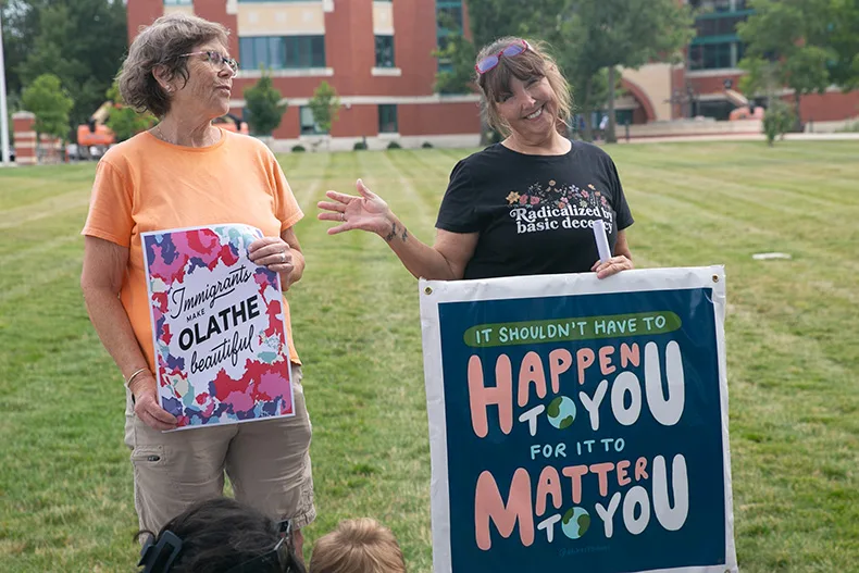 A woman holds a sign that reads "it shouldn't have to happen to you for it to matter to you." Photo credit Juliana Garcia. 