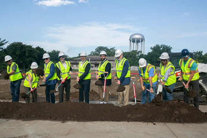 Prairie Village breaks ground on its new city hall at 7820 Mission Road. From left to right, Councilmembers Terry O'Toole, Betsy Lawrence, Jim Sellers and Nathan Vallette, Mayor Eric Mikkelson, Chair Mike Kelly, Kansas Rep. Jerry Stogsdill, City Administrator Wes Jordan, Commissioner Becky Fast and Public Works Director Keith Bredehoeft. Photo credit Juliana Garcia.