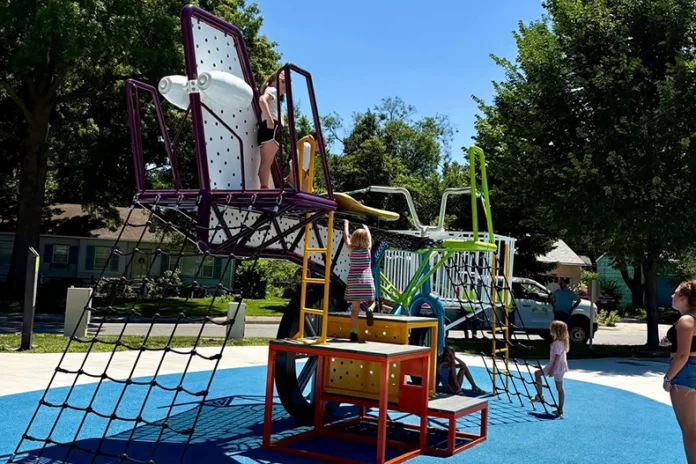 Kids play on The Mighty Bike in mid-June. Photo credit Cece Riley with the city of Roeland Park.