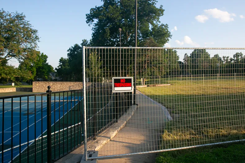 The tennis courts at Joe D. Dennis Park (left) abuts the former Westwood View Elementary property (right), which is on track to become a residential redevelopment. Photo credit Juliana Garcia. 