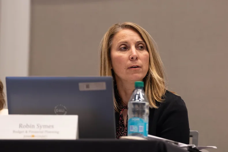 Johnson County Deputy Budget and Financial Planning Director Robin Symes gives a presentation before public comment at the Johnson County 2027 Budget Hearing and Revenue Neutral Rate Hearing at the Olathe Conference Center on Tuesday night.