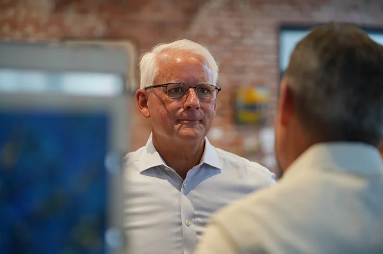 Overland Park Mayor Curt Skoog chats with constituents, family and friends during his Tuesday night watch party for his gubernatorial bid at 80 Santa Fe Art Center in downtown Overland Park.