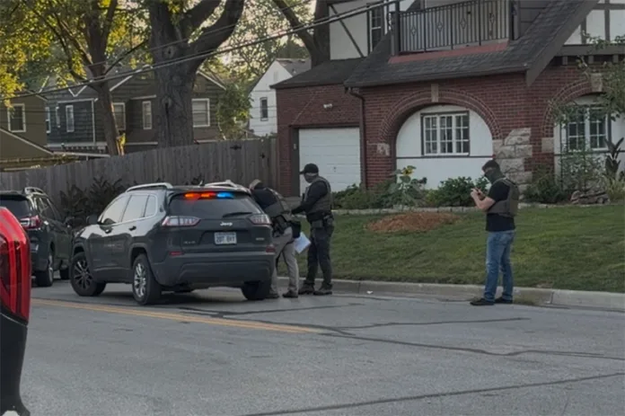 ICE agents detaining a man on Aug. 28.