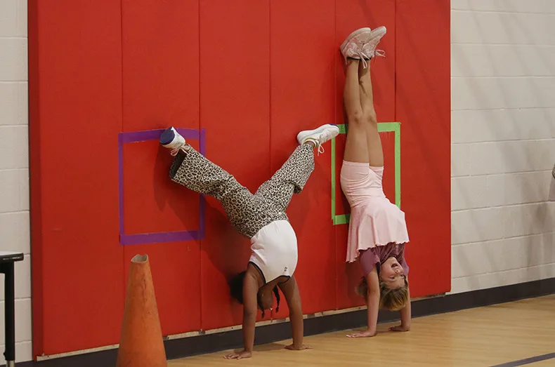 Fifth-graders at Prairie Creek Elementary School play during gym class on the first day of school.