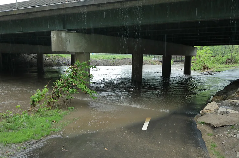 Tomahawk Creek flooded in April, leaving its banks and partially submerging the trail under the 119th Street overpass.