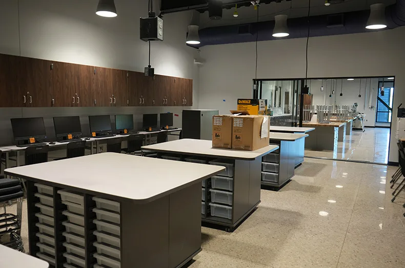 For students interested in building things, a drafting room sits next to the construction room with a clear sliding door that allows for teachers to monitor both students still drafting and those who are ready to start work.