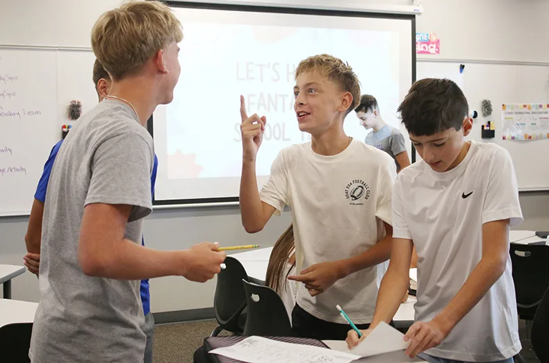 Students play a game during an English class at Woodland Springs Middle School.