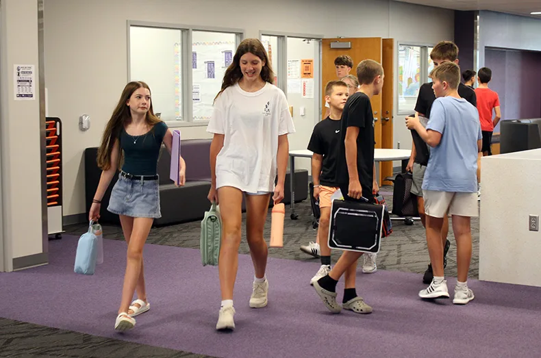 Students walk through the hallway at Woodland Springs Middle School.