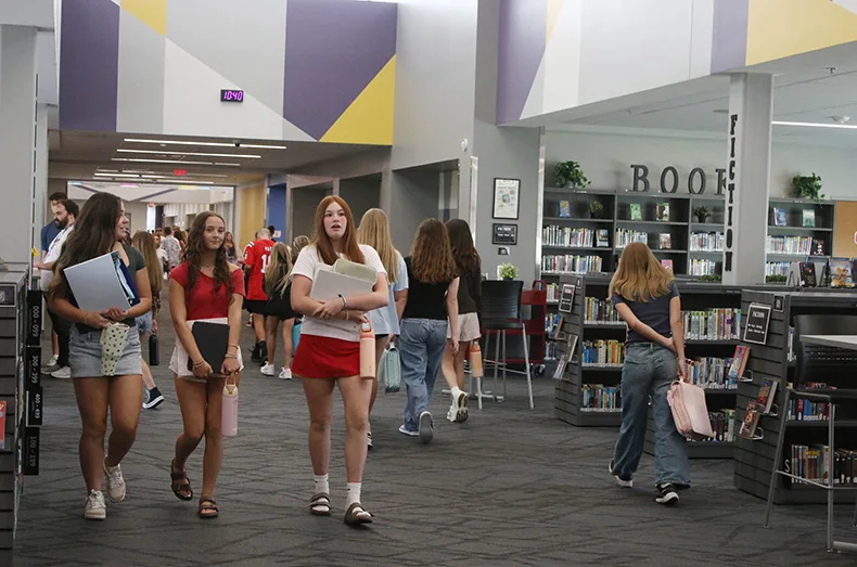 Students walk through the hallway at Woodland Springs Middle School.